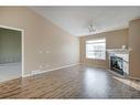 126 Mt Douglas Villas Se, Calgary, AB  - Indoor Photo Showing Living Room With Fireplace 