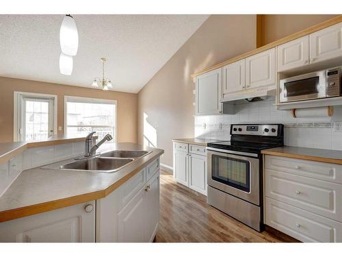 126 Mt Douglas Villas Se, Calgary, AB - Indoor Photo Showing Kitchen With Double Sink