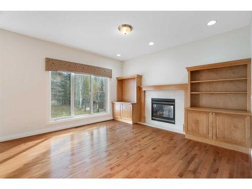 11 Evercreek Bluffs Road Sw, Calgary, AB - Indoor Photo Showing Living Room With Fireplace