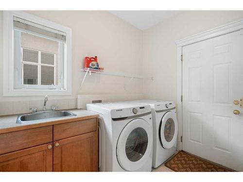 11 Evercreek Bluffs Road Sw, Calgary, AB - Indoor Photo Showing Laundry Room