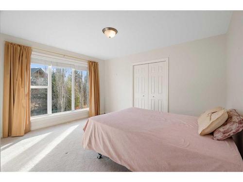 11 Evercreek Bluffs Road Sw, Calgary, AB - Indoor Photo Showing Bedroom