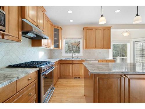 11 Evercreek Bluffs Road Sw, Calgary, AB - Indoor Photo Showing Kitchen With Stainless Steel Kitchen With Double Sink With Upgraded Kitchen