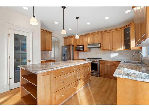 11 Evercreek Bluffs Road Sw, Calgary, AB - Indoor Photo Showing Kitchen With Stainless Steel Kitchen With Double Sink With Upgraded Kitchen