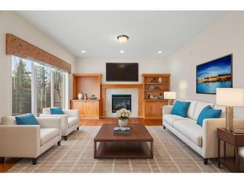 11 Evercreek Bluffs Road Sw, Calgary, AB - Indoor Photo Showing Living Room With Fireplace