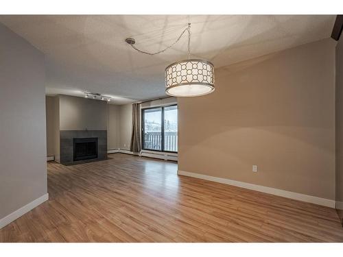 403-618 2 Avenue Nw, Calgary, AB - Indoor With Fireplace