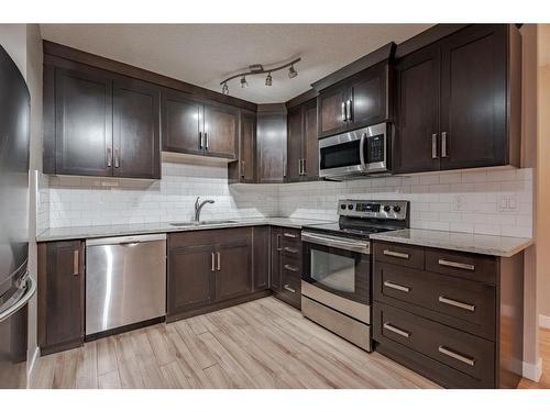 403-618 2 Avenue Nw, Calgary, AB - Indoor Photo Showing Kitchen With Stainless Steel Kitchen