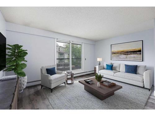 206-234 5 Avenue Ne, Calgary, AB - Indoor Photo Showing Living Room