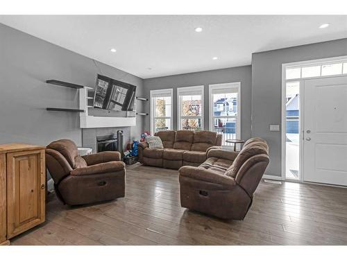 29 Amery Crescent, Crossfield, AB - Indoor Photo Showing Living Room With Fireplace