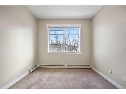 301-22 Panatella Road Nw, Calgary, AB - Indoor Photo Showing Other Room