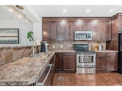 91 Auburn Bay Boulevard Se, Calgary, AB - Indoor Photo Showing Kitchen With Double Sink