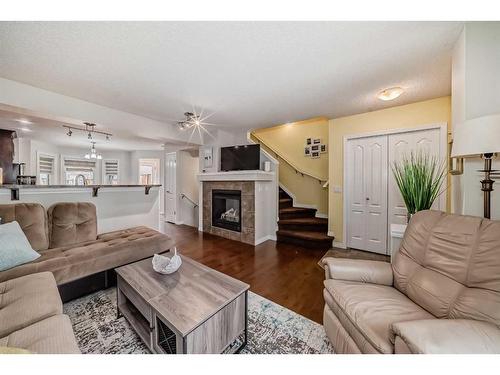 91 Auburn Bay Boulevard Se, Calgary, AB - Indoor Photo Showing Living Room With Fireplace