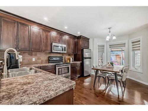 91 Auburn Bay Boulevard Se, Calgary, AB - Indoor Photo Showing Kitchen With Stainless Steel Kitchen With Double Sink