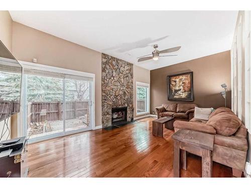 579 Point Mckay Grove Nw, Calgary, AB - Indoor Photo Showing Living Room With Fireplace