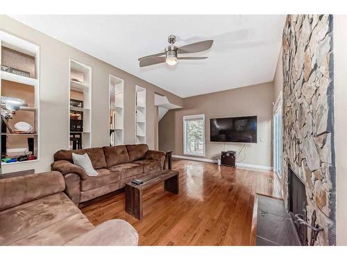 579 Point Mckay Grove Nw, Calgary, AB - Indoor Photo Showing Living Room With Fireplace