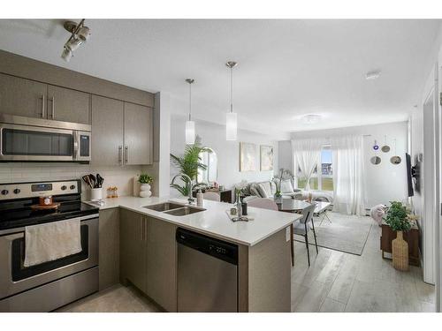 6406-302 Skyview Ranch Drive Ne, Calgary, AB - Indoor Photo Showing Kitchen With Stainless Steel Kitchen With Double Sink With Upgraded Kitchen