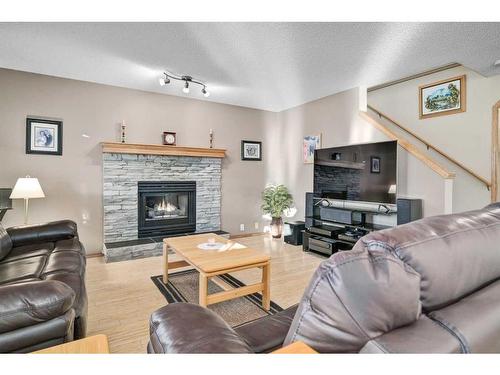 152 Del Ray Close Ne, Calgary, AB - Indoor Photo Showing Living Room With Fireplace