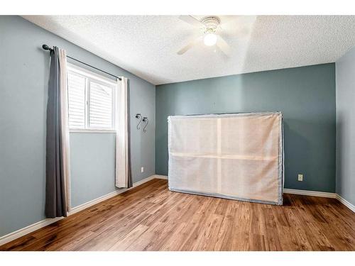 128 8 Avenue Se, High River, AB - Indoor Photo Showing Bedroom