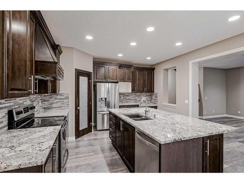 146 Evanspark Circle Nw, Calgary, AB - Indoor Photo Showing Kitchen With Double Sink With Upgraded Kitchen