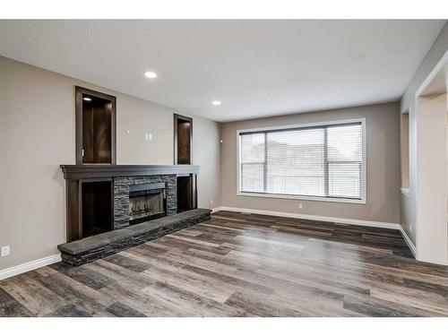 146 Evanspark Circle Nw, Calgary, AB - Indoor Photo Showing Living Room With Fireplace