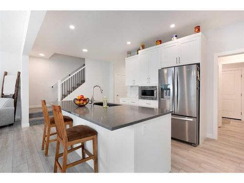 118 Ranchers View, Okotoks, AB - Indoor Photo Showing Kitchen With Stainless Steel Kitchen