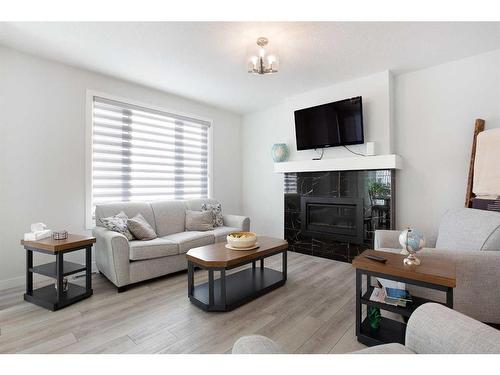 118 Ranchers View, Okotoks, AB - Indoor Photo Showing Living Room With Fireplace