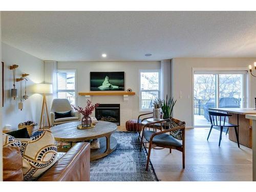 74 Silverado Range Heights Sw, Calgary, AB - Indoor Photo Showing Living Room With Fireplace