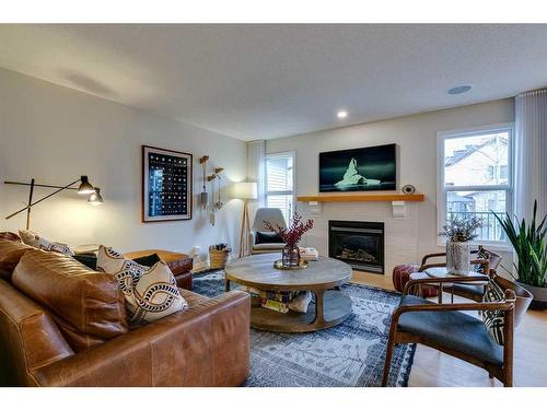 74 Silverado Range Heights Sw, Calgary, AB - Indoor Photo Showing Living Room With Fireplace