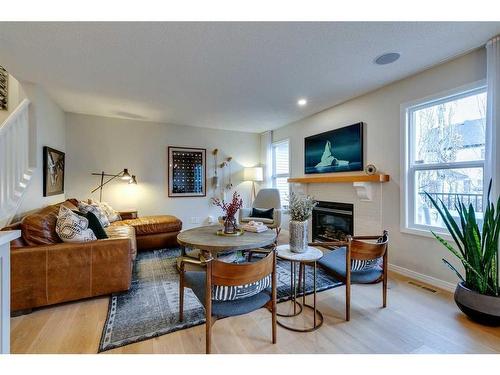 74 Silverado Range Heights Sw, Calgary, AB - Indoor Photo Showing Living Room With Fireplace