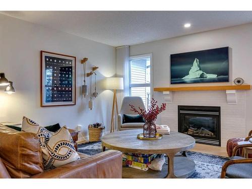 74 Silverado Range Heights Sw, Calgary, AB - Indoor Photo Showing Living Room With Fireplace