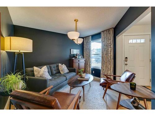 74 Silverado Range Heights Sw, Calgary, AB - Indoor Photo Showing Living Room