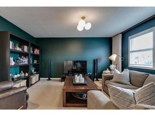 74 Silverado Range Heights Sw, Calgary, AB - Indoor Photo Showing Living Room