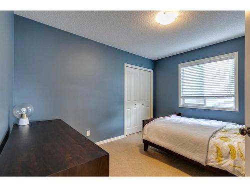 74 Silverado Range Heights Sw, Calgary, AB - Indoor Photo Showing Bedroom