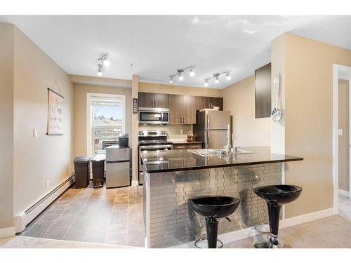 3211-625 Glenbow Drive, Cochrane, AB - Indoor Photo Showing Kitchen With Double Sink