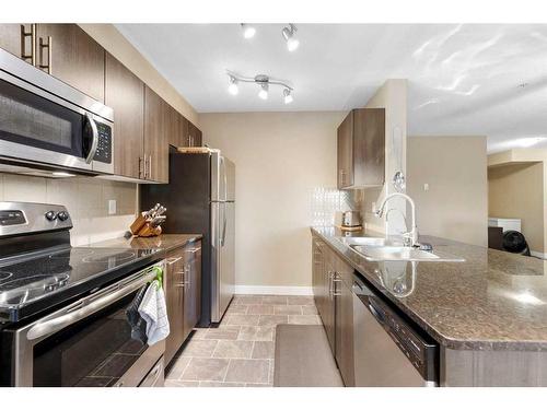 3211-625 Glenbow Drive, Cochrane, AB - Indoor Photo Showing Kitchen With Double Sink