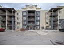 3211-625 Glenbow Drive, Cochrane, AB  - Outdoor With Balcony With Facade 