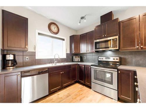 9 Belgian Street, Cochrane, AB - Indoor Photo Showing Kitchen With Stainless Steel Kitchen