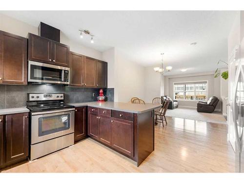 9 Belgian Street, Cochrane, AB - Indoor Photo Showing Kitchen