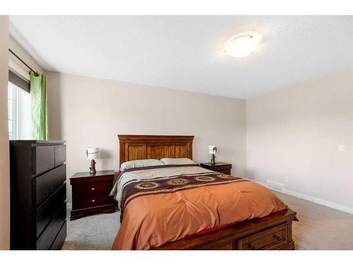 9 Belgian Street, Cochrane, AB - Indoor Photo Showing Bedroom