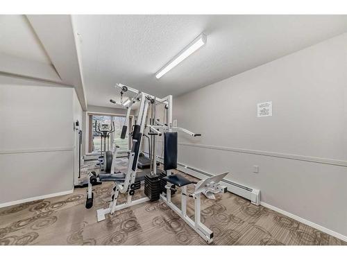 115-5000 Somervale Court Sw, Calgary, AB - Indoor Photo Showing Gym Room