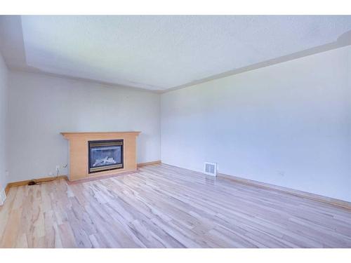 2021 21 Avenue Nw, Calgary, AB - Indoor Photo Showing Living Room With Fireplace