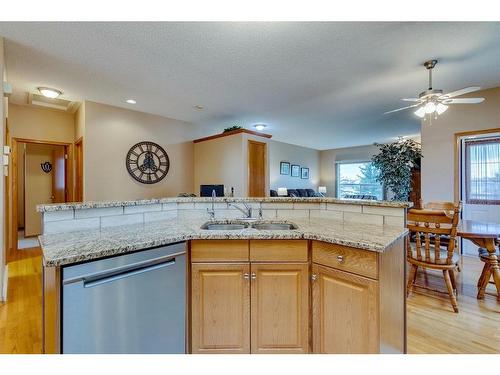 605 Woodside Court Nw, Airdrie, AB - Indoor Photo Showing Kitchen With Double Sink