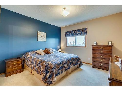 605 Woodside Court Nw, Airdrie, AB - Indoor Photo Showing Bedroom