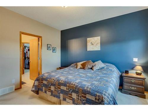 605 Woodside Court Nw, Airdrie, AB - Indoor Photo Showing Bedroom