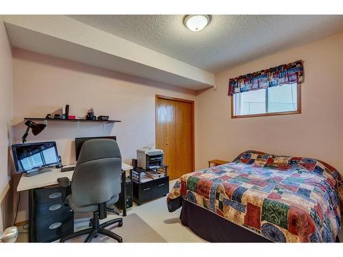 605 Woodside Court Nw, Airdrie, AB - Indoor Photo Showing Bedroom