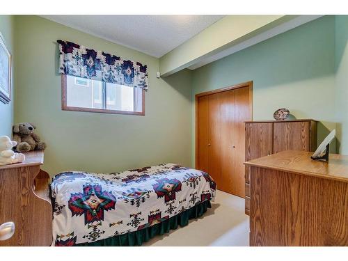 605 Woodside Court Nw, Airdrie, AB - Indoor Photo Showing Bedroom