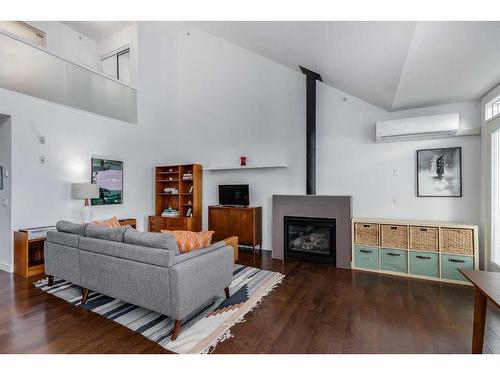 307-3650 Marda Link Sw, Calgary, AB - Indoor Photo Showing Living Room With Fireplace