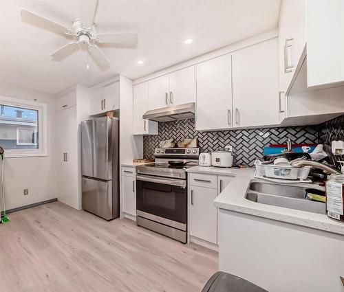 2923 Doverville Crescent Se, Calgary, AB - Indoor Photo Showing Kitchen With Stainless Steel Kitchen