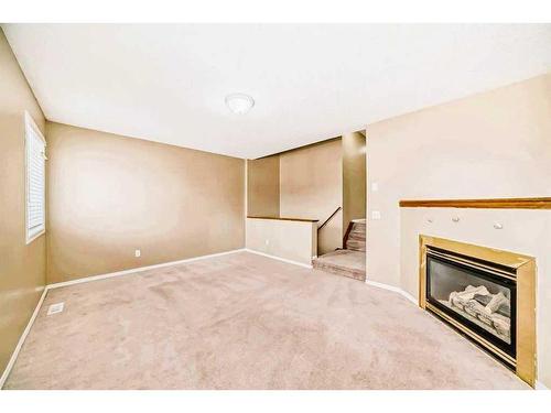 69 Saddlehorn Crescent Ne, Calgary, AB - Indoor With Fireplace