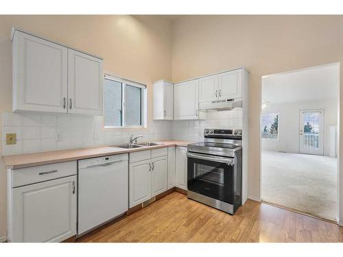 309 Sierra Morena Green Sw, Calgary, AB - Indoor Photo Showing Kitchen With Double Sink