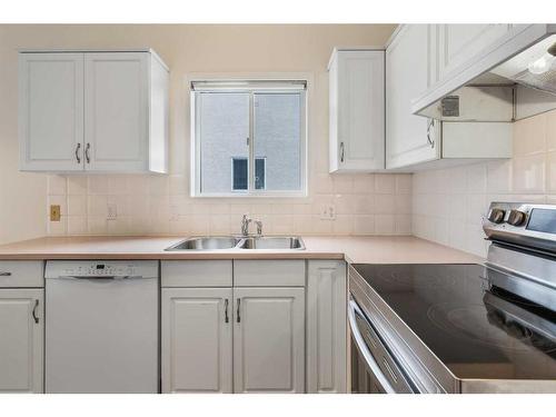 309 Sierra Morena Green Sw, Calgary, AB - Indoor Photo Showing Kitchen With Double Sink